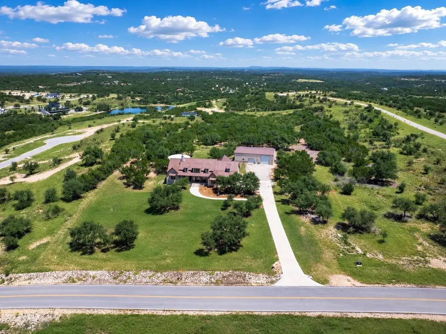 Aerial view of a Hill Country estate and surrounding open land
